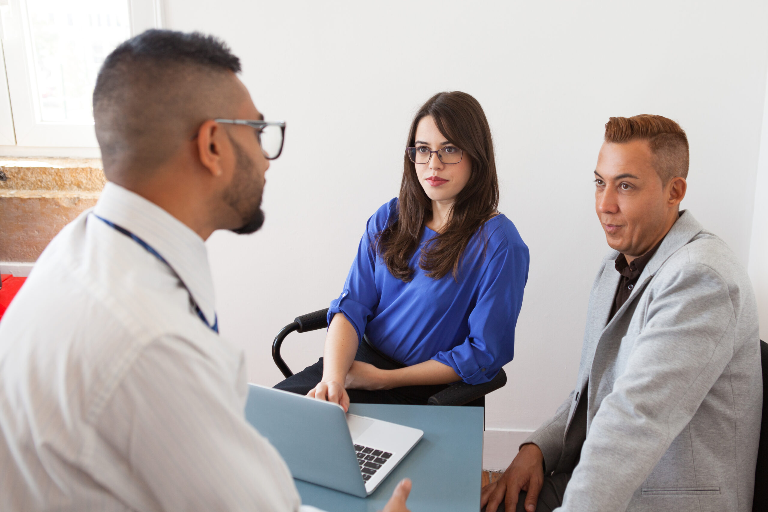 serious executives listening to colleagues idea